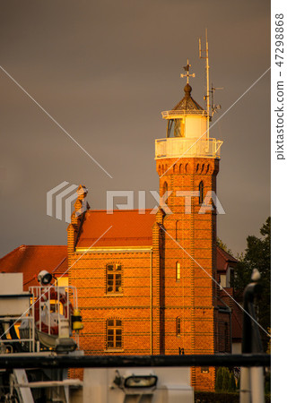 Old lighthouse in golden evening lighting Old lighthouse in golden evening lighting 47298868