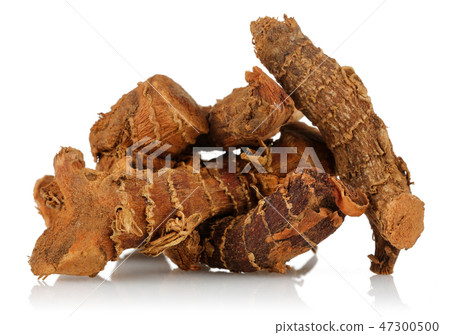 Dry Galangal root on white background Dry Galangal root on white background 47300500