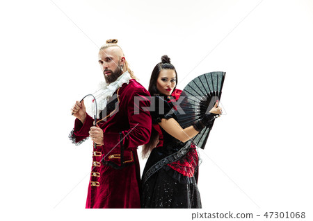 The young man wearing a traditional medieval costume of marquis and woman as marquise 47301068