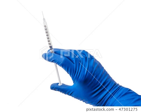 Doctor's hand in blue medical glove holding open syringe with medical solution isolated white Doctor's hand in blue medical glove holding open syringe with medical solution isolated white 47301275