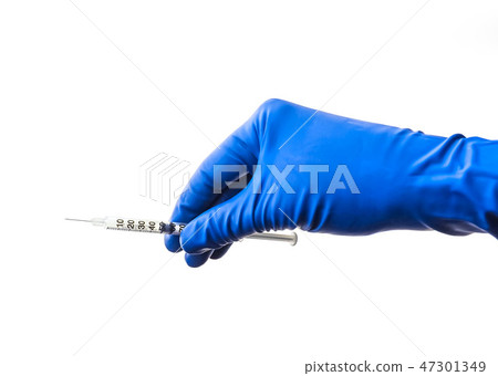 Doctor's hand in blue medical glove holding open syringe with medical solution isolated white Doctor's hand in blue medical glove holding open syringe with medical solution isolated white 47301349