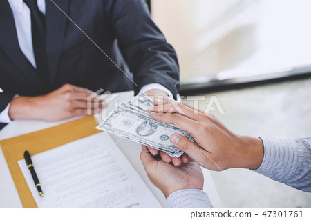 Bribery and corruption concept, bribe in the form of dollar bill 47301761