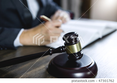 Counselor or Male lawyer working on courtroom sitting at the tab 47301762
