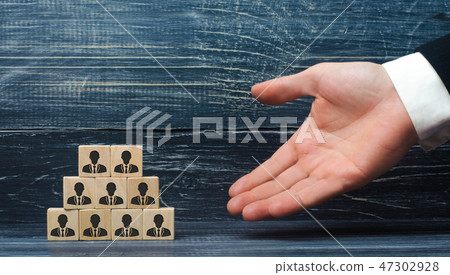 Headhunter shows on a pyramid of employees 47302928