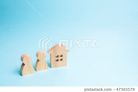 Two figures of people and a wooden house Two figures of people and a wooden house 47303579
