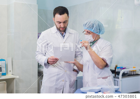 Healthcare: Doctor and patient discussing blood-test results Healthcare: Doctor and patient discussing blood-test results 47303801