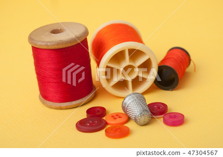 closeup of sewing set on yellow  background 47304567
