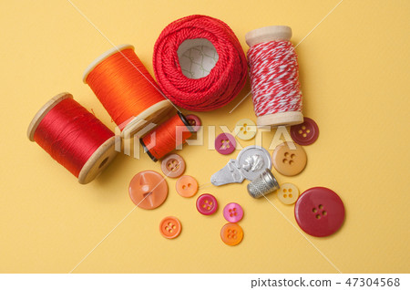 closeup of sewing set on yellow  background 47304568