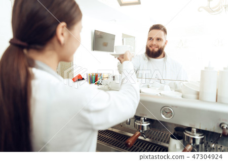 Female barista preparing coffee at coffee shop Female barista preparing coffee at coffee shop 47304924