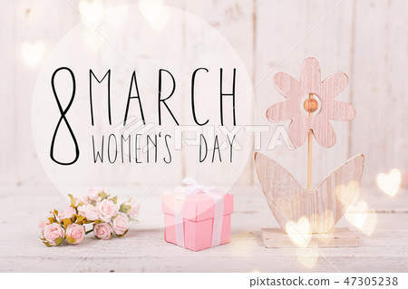 Flowers composition for Women's Day. Pink flowers on old white wooden background. 47305238