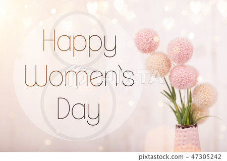 Flowers composition for Women's Day. Pink flowers on old white wooden background. 47305242