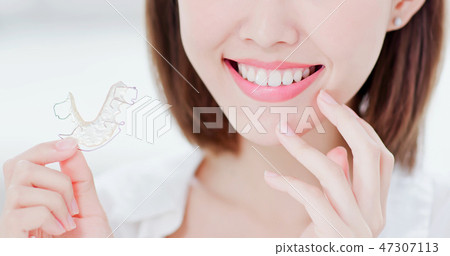 woman with retainer for teeth woman with retainer for teeth 47307113