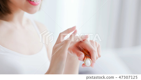 woman apply moisturizer in hand woman apply moisturizer in hand 47307125
