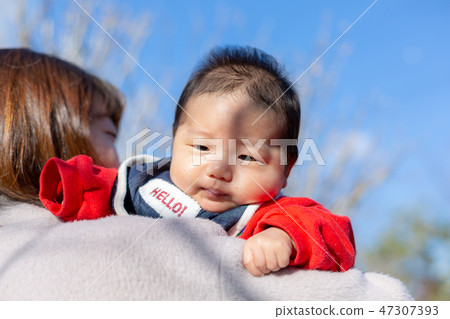 Parent and child taking a walk Parent and child taking a walk 47307393