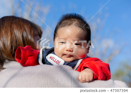 Parent and child taking a walk Parent and child taking a walk 47307394