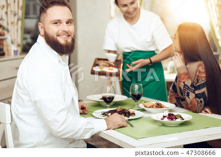Romantic dinner happy men and women in restaurant Romantic dinner happy men and women in restaurant 47308666