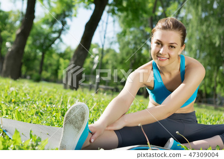 Girl practicing stretching exercises Girl practicing stretching exercises 47309004