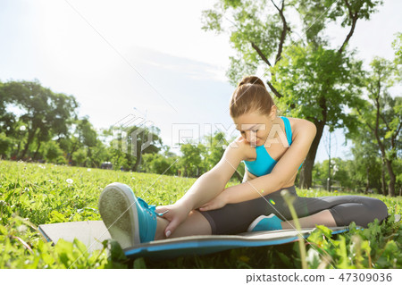 Girl practicing stretching exercises 47309036