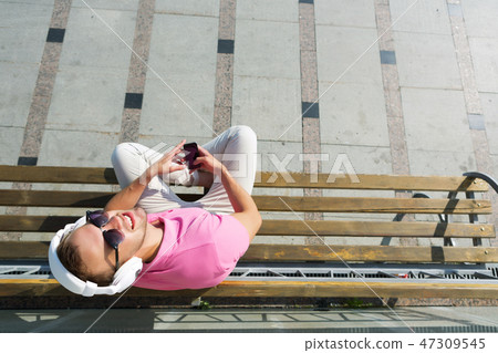 Guy in headphones enjoying music 47309545