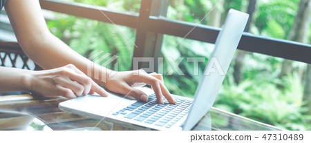 Business woman working with a laptop computer. Business woman working with a laptop computer. 47310489