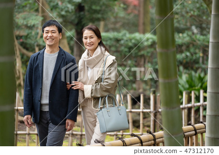 Middle couple travel Autumn foliage sightseeing image Middle couple travel Autumn foliage sightseeing image 47312170