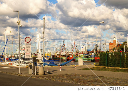 Fishing port of Ustka, Poland with old lighthouse Fishing port of Ustka, Poland with old lighthouse 47313841