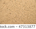 Sand of a beach with rain holes 47313877