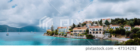Superb scene of Fiskardo town with Zavalata Beach. Seascape of Ionian Sea on overcast day. Tranquil 47314292