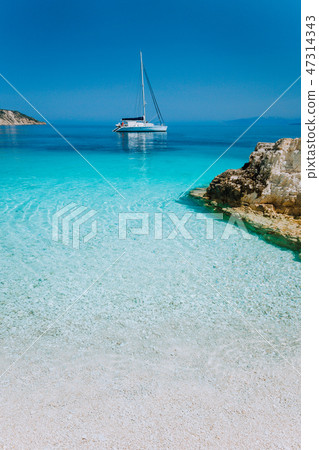 Luxury boat yacht anchored in a bay of tropical Island Luxury boat yacht anchored in a bay of tropical Island 47314343