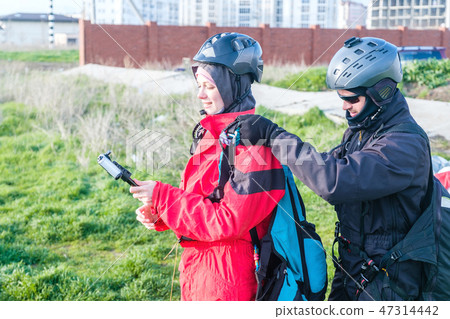 Preparation of tandem paraglider for the first flight Preparation of tandem paraglider for the first flight 47314442