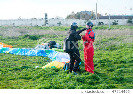 Preparation of tandem paraglider for the first flight Preparation of tandem paraglider for the first flight 47314495