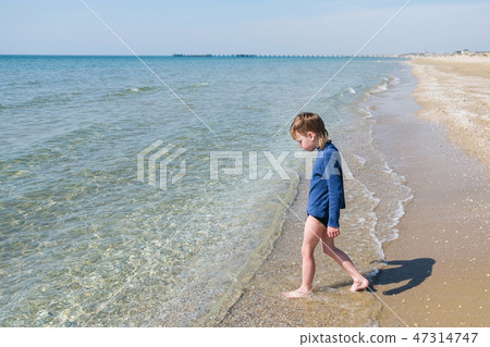 Little boy at sand beach Little boy at sand beach 47314747
