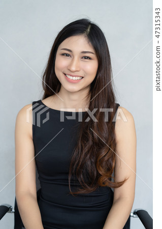Portrait of a smiling Asian pretty business woman Portrait of a smiling Asian pretty business woman 47315343