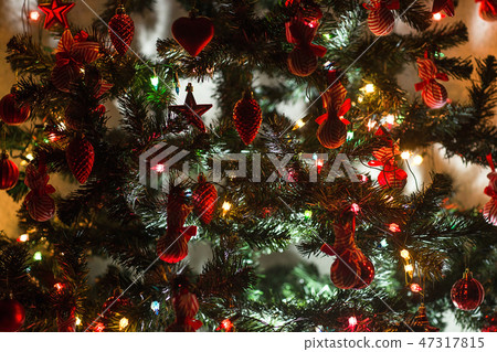 decorated with baubles and garlands decorated with baubles and garlands 47317815