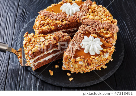 peanut cake topped with cocoa peanut butter cream peanut cake topped with cocoa peanut butter cream 47318491