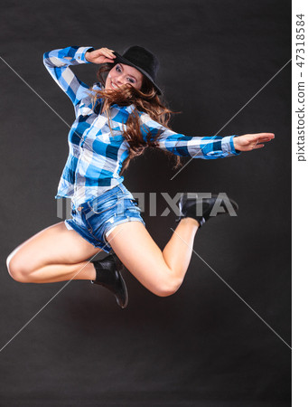 Happy and joyful woman girl jumping and having fun Happy and joyful woman girl jumping and having fun 47318584