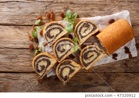 Delicious pastry poppy roll with raisins, nuts 47320912