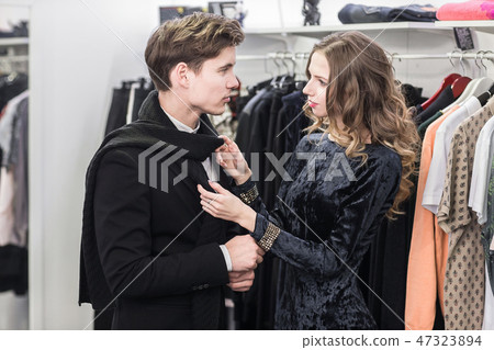 young and fashionable couple shopping clothes 47323894