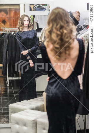 woman in fitting room at a clothing store 47323963