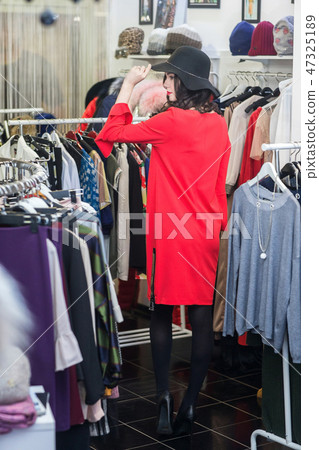 woman is in the ready-made shop woman is in the ready-made shop 47325189