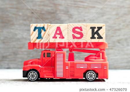 Toy fire ladder truck hold block in word task 47326070