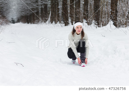 woman running jogging in the winter forest 47326756