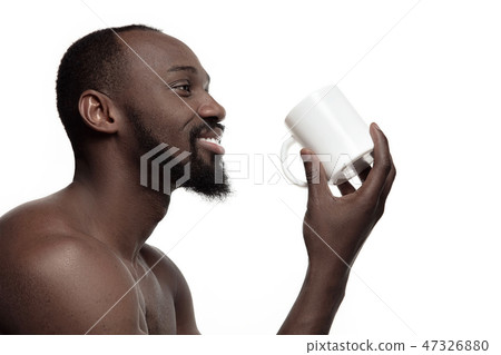 African man with cup of tea, isolated on white background 47326880