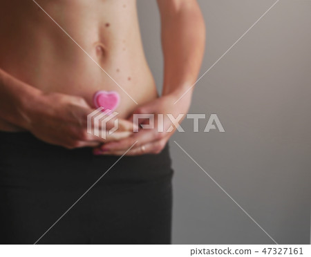 pregnant women hand heart belly woman health concept menstruation cycle pregnant women hand heart belly woman health concept menstruation cycle 47327161