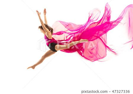 Ballerina. Young graceful female ballet dancer dancing over white studio. Beauty of classic ballet. 47327336