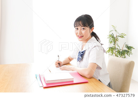 A young student studying in uniform uniform A young student studying in uniform uniform 47327579