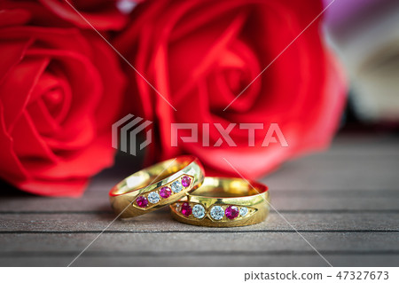 Close up wedding ring and red rose Close up wedding ring and red rose 47327673