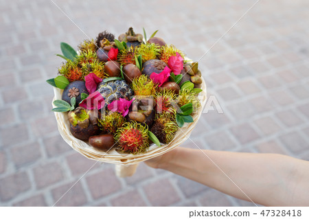 Woman holding in her hand the tasty gift Woman holding in her hand the tasty gift 47328418