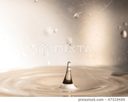 orange water splash isolated 47328489