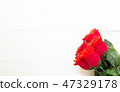 Present gift with red rose flower on wooden table, 14 February o 47329178